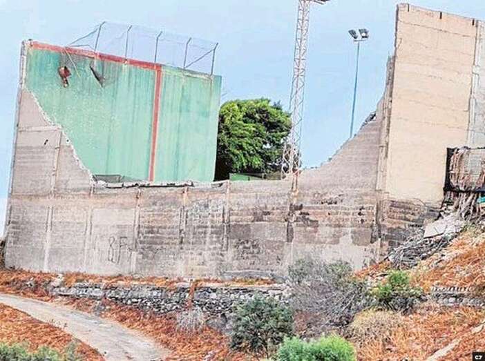 Imagen del muro caído/C7.